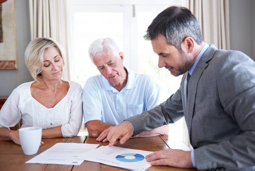 Retired couple reviewing their cross-border financial and pension planning before moving to Spain