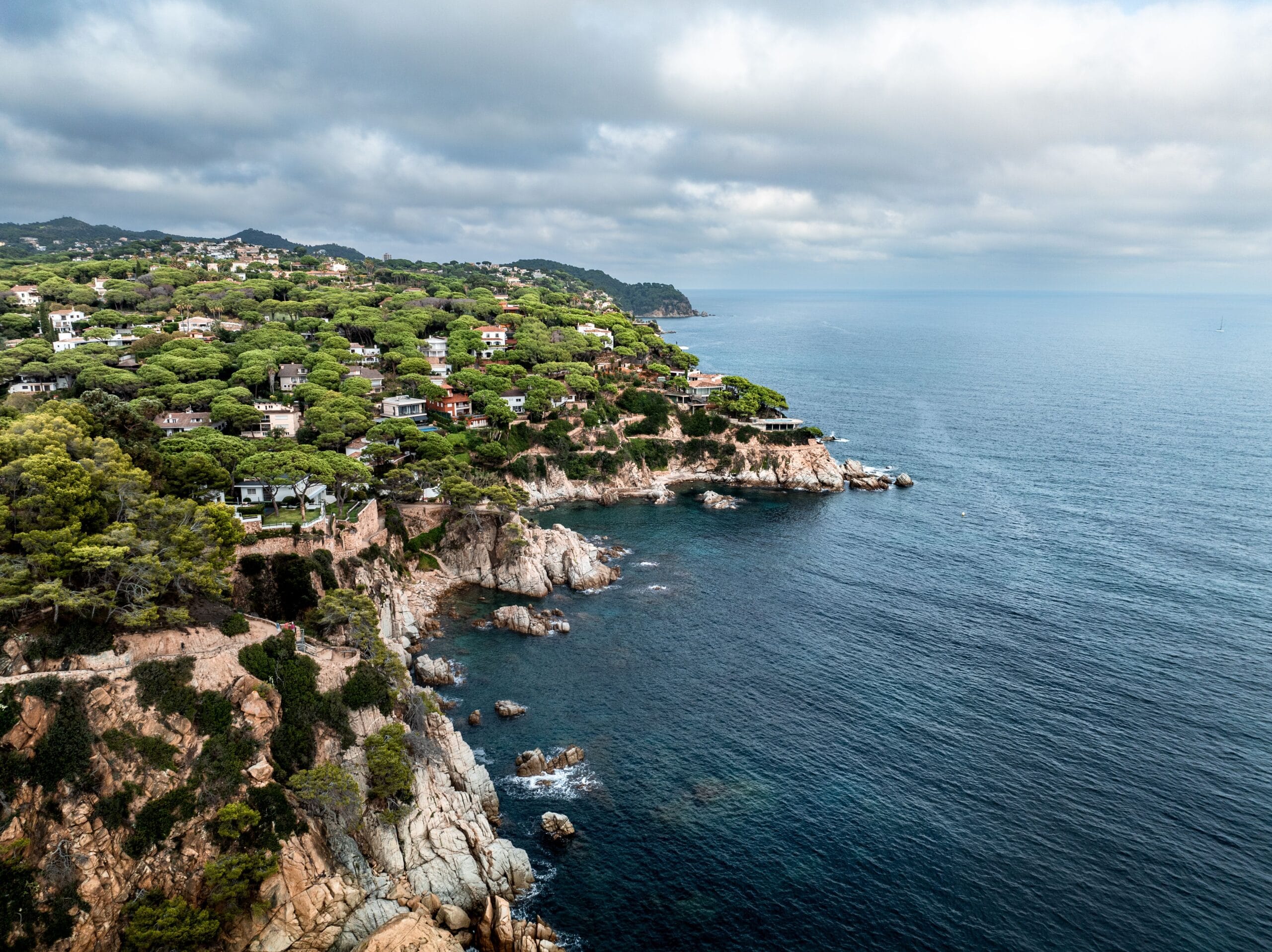Spanish Mediterranean coastline with a beachfront villa above the sand