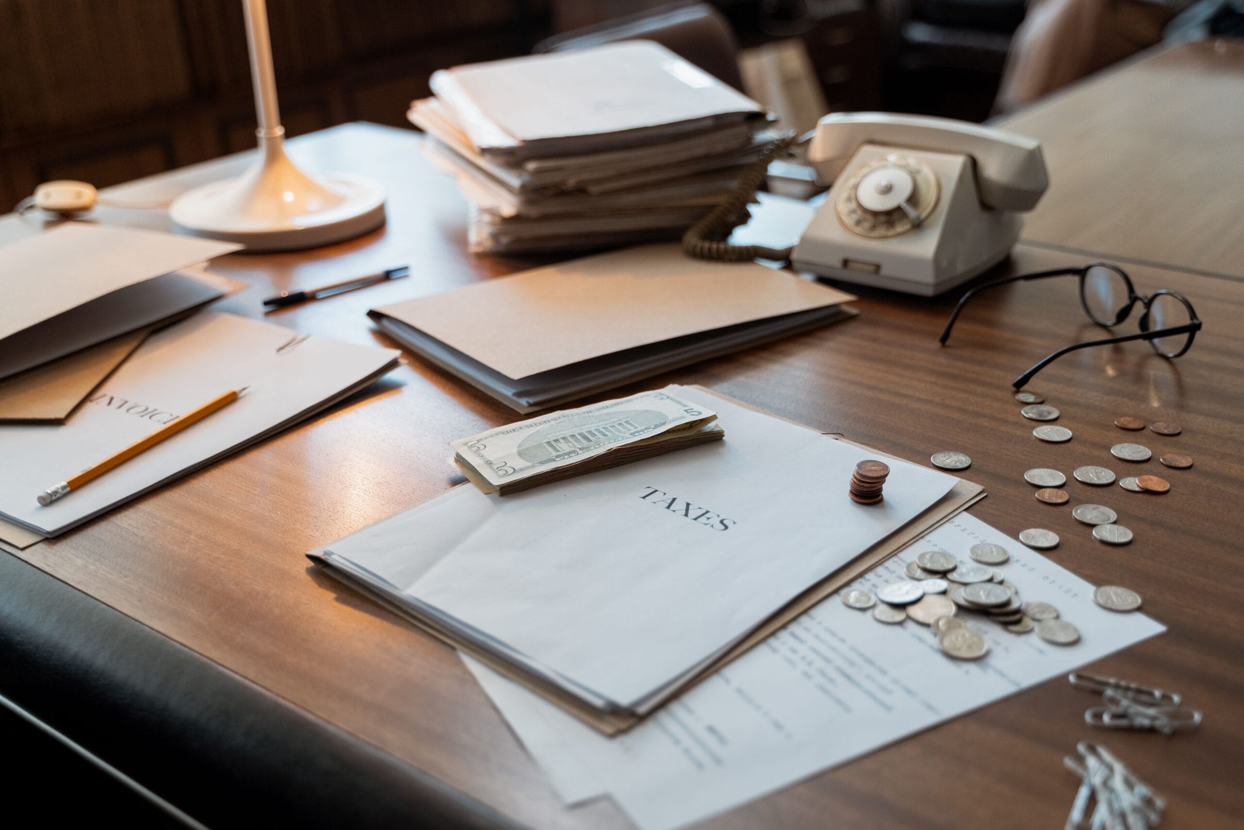 Bank statements and financial documents spread across a desk, the paperwork needed to value foreign accounts and investments for Spain's Modelo 720